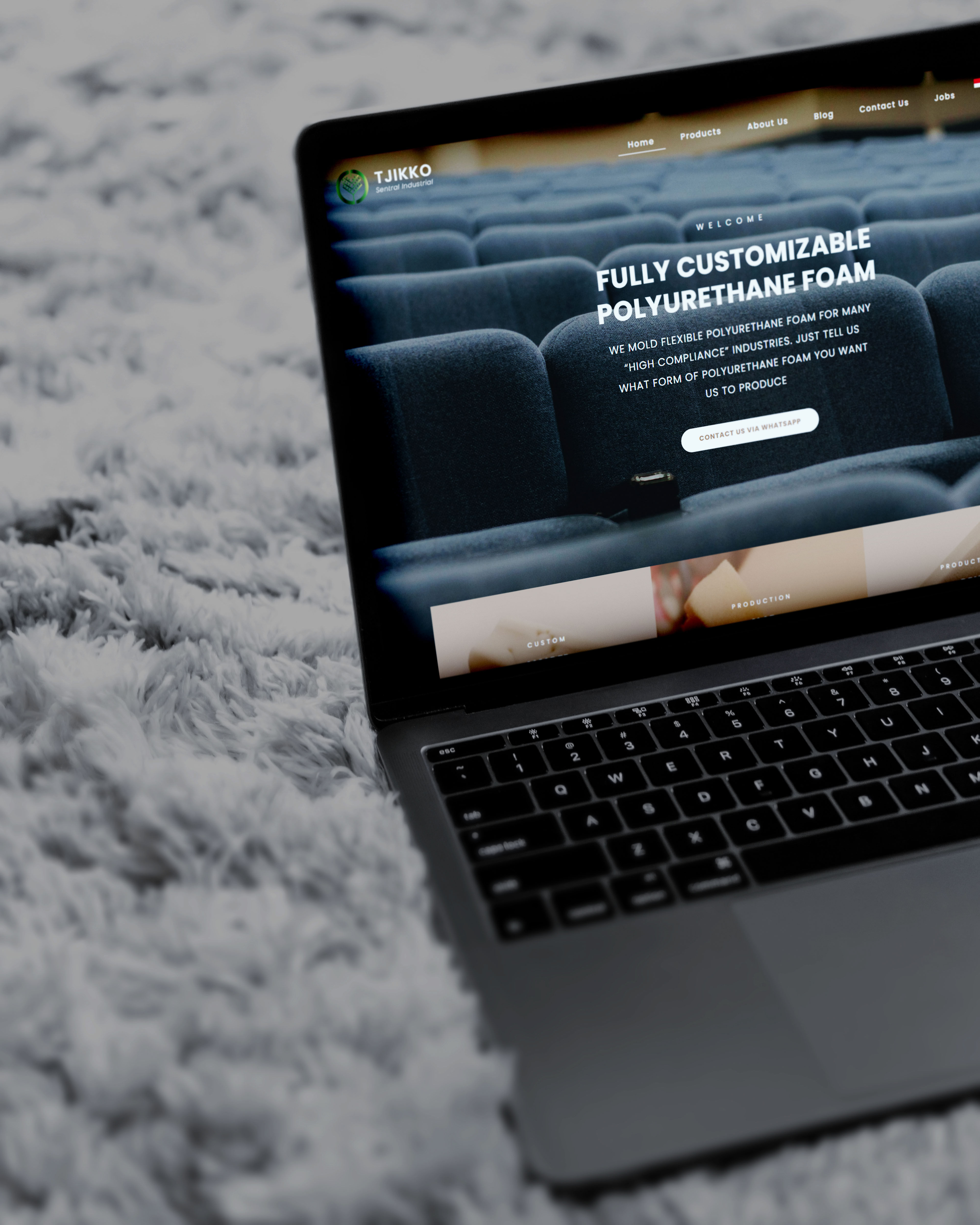 E-commerce store mockup inside a silver laptop frame